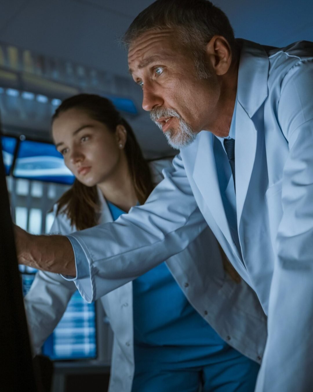 two-people-looking-computer-screen-that-says-future-technology